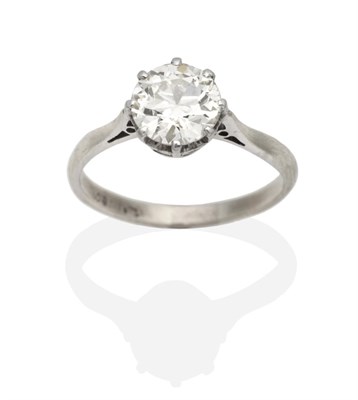 Lot 360 - A Solitaire Diamond Ring, a round brilliant cut diamond in a claw setting, to knife edge shoulders