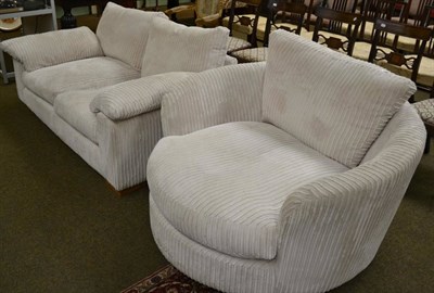 Lot 1286 - Modern cream sofa and matching swivel armchair