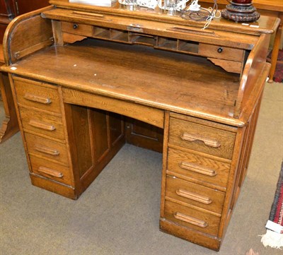 Lot 1309 - 1920s oak roll top desk