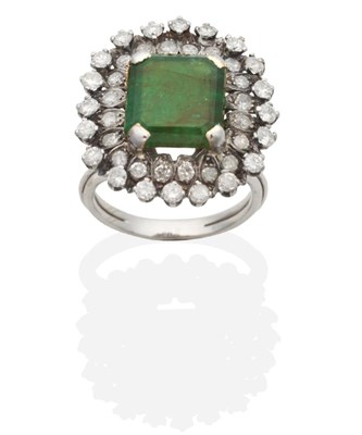 Lot 364 - An Emerald and Diamond Cluster Ring, an octagonal cut emerald within a two tier border of eight-cut