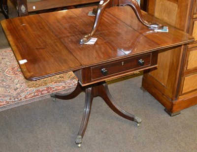 Lot 1315 - Regency mahogany Pembroke table on quadruped support and brass lion paw feet