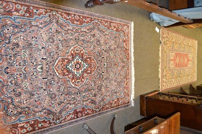 Lot 1316 - Indian rug, the soft mushroom field of vines around a rust medallion framed by spandrels and narrow