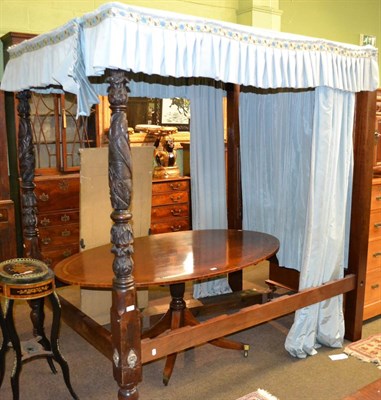 Lot 1319 - Carved mahogany four poster bed