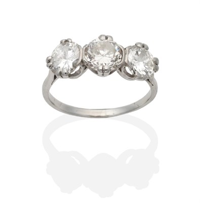 Lot 366 - A Three Stone Diamond Ring, round brilliant cut diamonds in claw and rubbed over settings, to knife