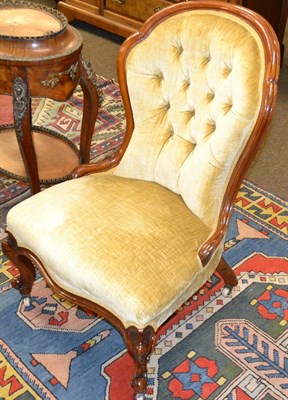 Lot 1367 - Victorian walnut framed open armchair upholstered in yellow velvet