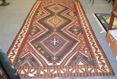 Lot 1368 - # Early 20th century Shirvan kilim, East Caucasus, the walnut ground with three linked serrated...