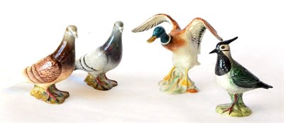 Lot 7 - Beswick Birds comprising: Pigeon, model No. 1383A, first version, red gloss; Pigeon, model No....