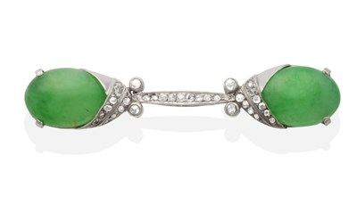 Lot 373 - An Art Deco Jade and Diamond Brooch, two oval jade cabochons in claw settings to a scroll bar...