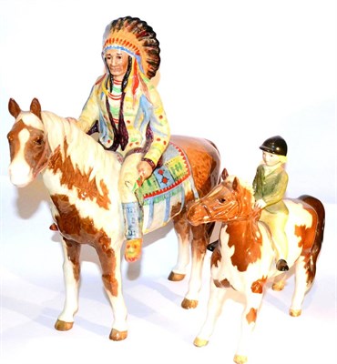 Lot 35 - Beswick Mounted Indian, model No. 1391, skewbald gloss; together with Girl on Pony, model No. 1499
