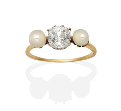 Lot 381 - An Old Mine Cut Diamond and Pearl Three Stone Ring, an old mine cut diamond in a claw setting...