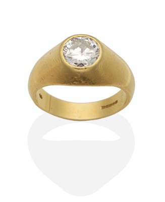 Lot 390 - An 18 Carat Gold Solitaire Diamond Ring, a round brilliant cut diamond inset to a tapering...