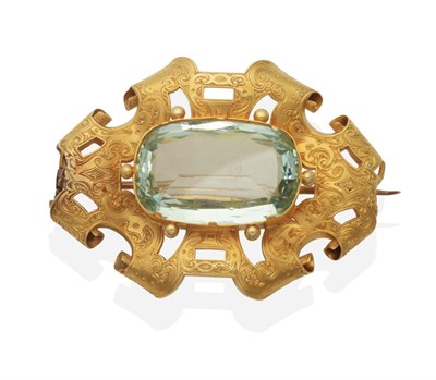 Lot 394 - An Aquamarine Brooch, an oval cut aquamarine in a claw setting and within a chased and pierced...