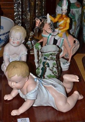 Lot 202 - Two Heubach baby figures, Staffordshire General on a horse and a Volunteer's jug