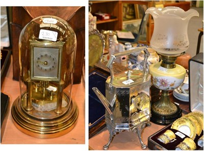 Lot 230 - A silver plated spirit kettle on stand, oil lamp and an anniversary clock