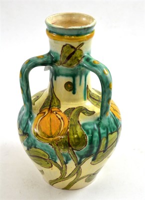 Lot 232 - A Della Robbia three handled vase decorated with Arts & Crafts flowers and foliage