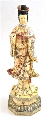 Lot 237 - A Japanese carved and stained bone okimono, 20th century, as a maiden wearing flowing robes on...