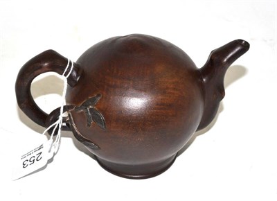 Lot 253 - A Chinese Yixing peach form teapot