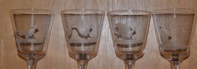 Lot 267 - A set of four 19th century wine glasses/goblets, each engraved with a cock fighting scene, each...