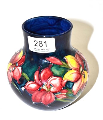 Lot 281 - A William Moorcroft Fresia pattern vase, on a blue ground, impressed factory marks and blue painted