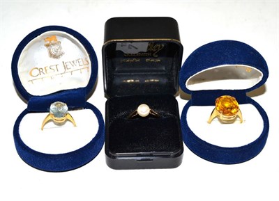 Lot 301 - Three dress rings, shanks stamped '18K' and '375'