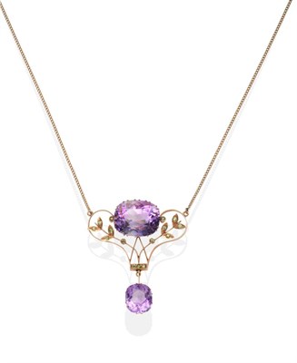 Lot 405 - A Russian Art Nouveau Amethyst and Demantoid Garnet Pendant Necklace, an oval cut amethyst in a...