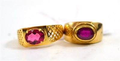 Lot 309 - An 18ct gold pink tourmaline ring and a 9ct gold ruby and diamond three stone ring (2)