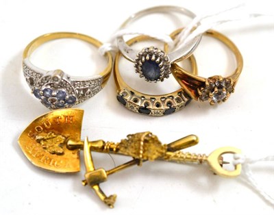 Lot 310 - Four various gem set rings and a 9ct gold brooch