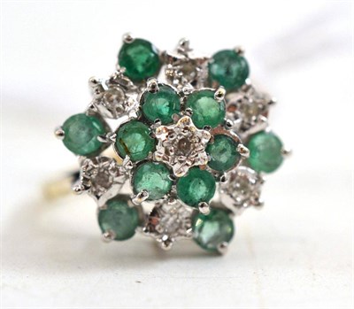 Lot 317 - A 9ct gold emerald and diamond cluster ring