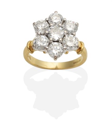 Lot 410 - An 18 Carat Gold Diamond Cluster Ring, round brilliant cut diamonds in claw settings, to forked...