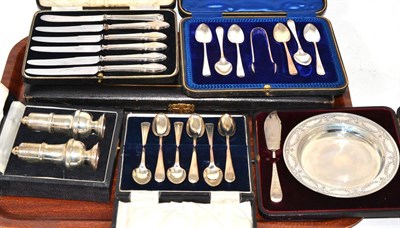 Lot 371 - Cased silver and flatware including: silver handled knives, steel knives and forks, a salt and...