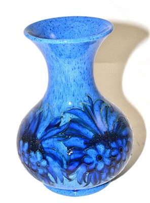 Lot 386 - A William Moorcroft vase, with a cornflower design on a powder blue ground, impressed factory marks