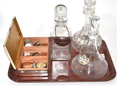 Lot 402 - Three decanters, two wristwatches and two pocket watches, dagger clip and a box