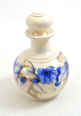 Lot 418 - A Walter Moorcroft Orchid and Spring Flowers pattern globular scent bottle and stopper, matt glaze