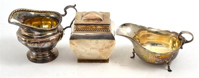 Lot 438 - A silver tea caddy, cream jug and sauceboat