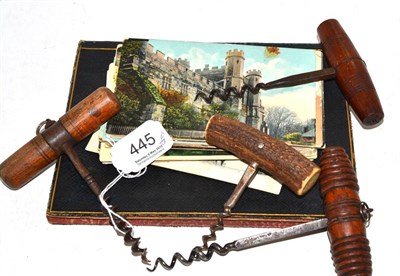 Lot 445 - Four corkscrews, quantity of postcards and an interesting collection of family crests