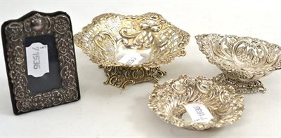 Lot 482 - Three silver dishes and a silver mounted photo frame