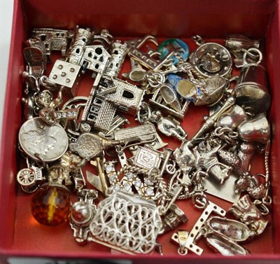 Lot 489 - A box of various silver and white metal charms