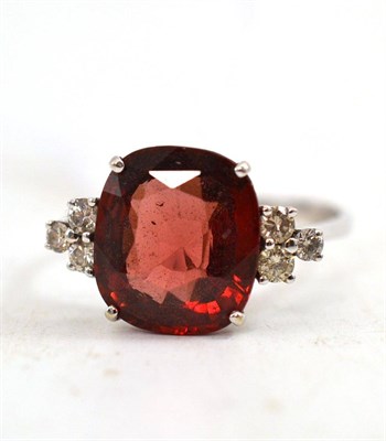 Lot 501 - An 18ct white gold garnet and diamond set ring