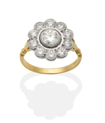 Lot 436 - A Diamond Cluster Ring, a round brilliant cut diamond within a diamond set halo frame, in...