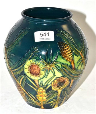 Lot 544 - A modern Moorcroft Amazon Twilight Pattern 4/8 Vase, designed by Nicola Slaney, on a dark green...