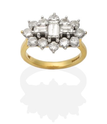 Lot 437 - An 18 Carat Gold Diamond Ring, three baguette cut diamonds within a border of round brilliant...