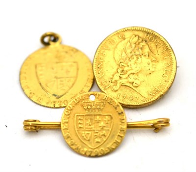 Lot 573 - A drilled coin on a bar brooch, a coin pendant and a coin brooch (3)