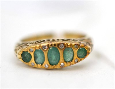 Lot 581 - A 9ct gold emerald and diamond ring