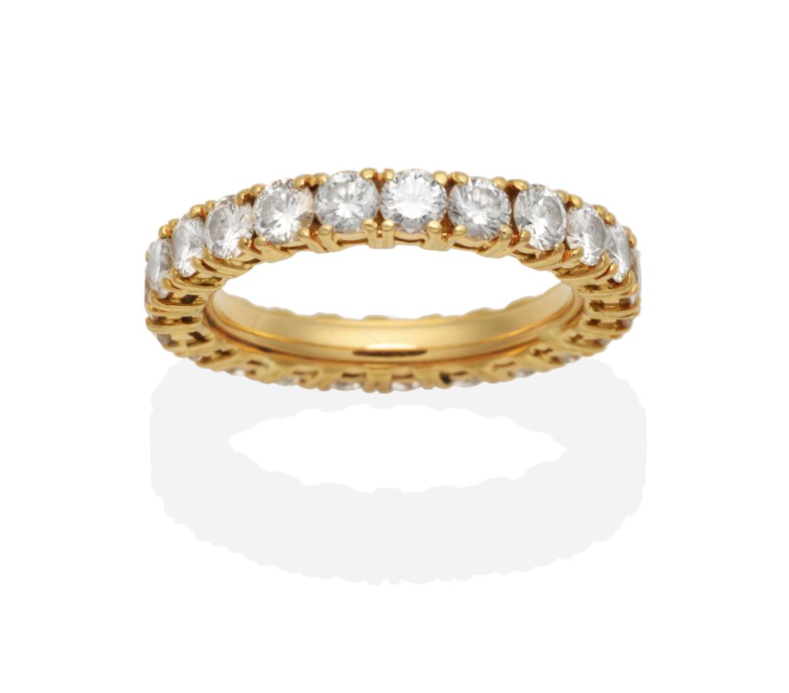 Lot 442 - A Diamond Eternity Ring, round brilliant cut diamonds in claw settings, total estimated diamond...