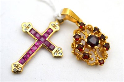 Lot 599 - A 9ct gold ruby and diamond cross pendant and a garnet pendant stamped '18K'