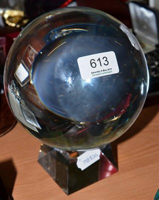 Lot 613 - A crystal ball and stand (14cm diameter)