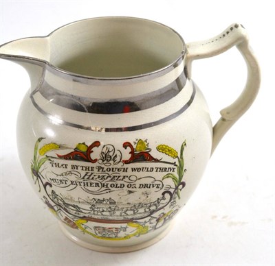 Lot 622 - A silver lustre jug