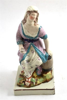 Lot 623 - An early 19th century pearlware figure, Widow