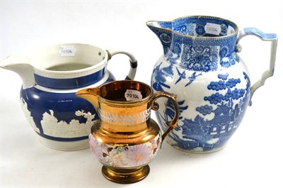 Lot 628 - A 19th century pearlware jug, decorated in the willow pattern, a Jasperware jug and a copper lustre