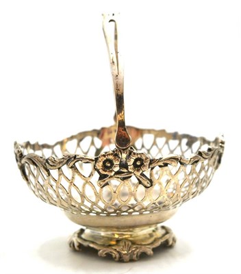 Lot 633 - A pierced silver basket with swing handle